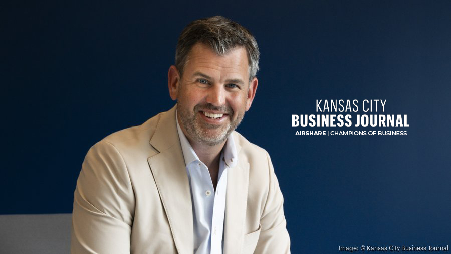 Picture of John Owen inside Airshare's Kansas City Headquarters. Headline Reads: Kansas City Business Journal - Airshare | Champions of Business