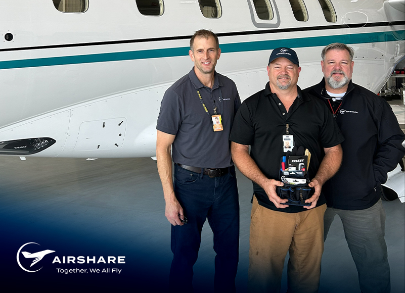 Airshare Employee accepting the Employee of the Month award while smiling with excitement.