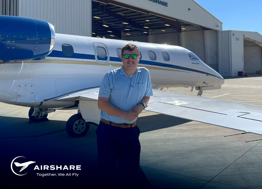 Airshare Employee Robert T. standing next to one of Airshare's Phenom 300's.