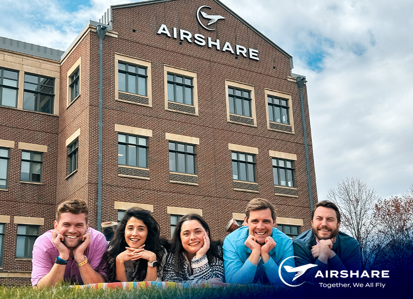 Part of the Airshare Charter Division creating a fun retro 90's themed photo in front of the Airshare HQ.
