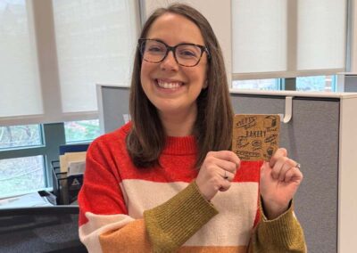 Airshare employee, Kelsey Porter, with her prize as the winner of the pie contest.