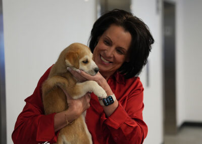 Airshare employee holding puppy,