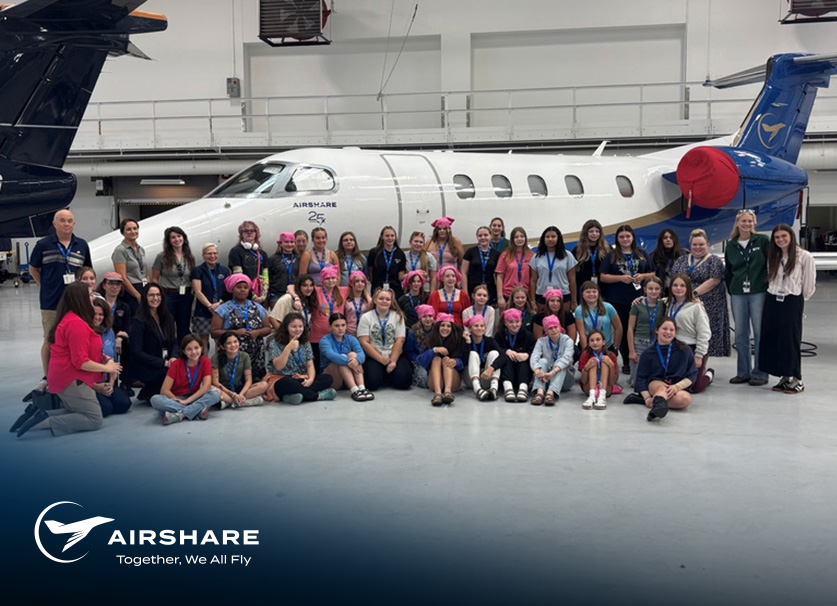 Group of representatives from Airshare and WAI gathered with young girls to present and talk about working in aviation.